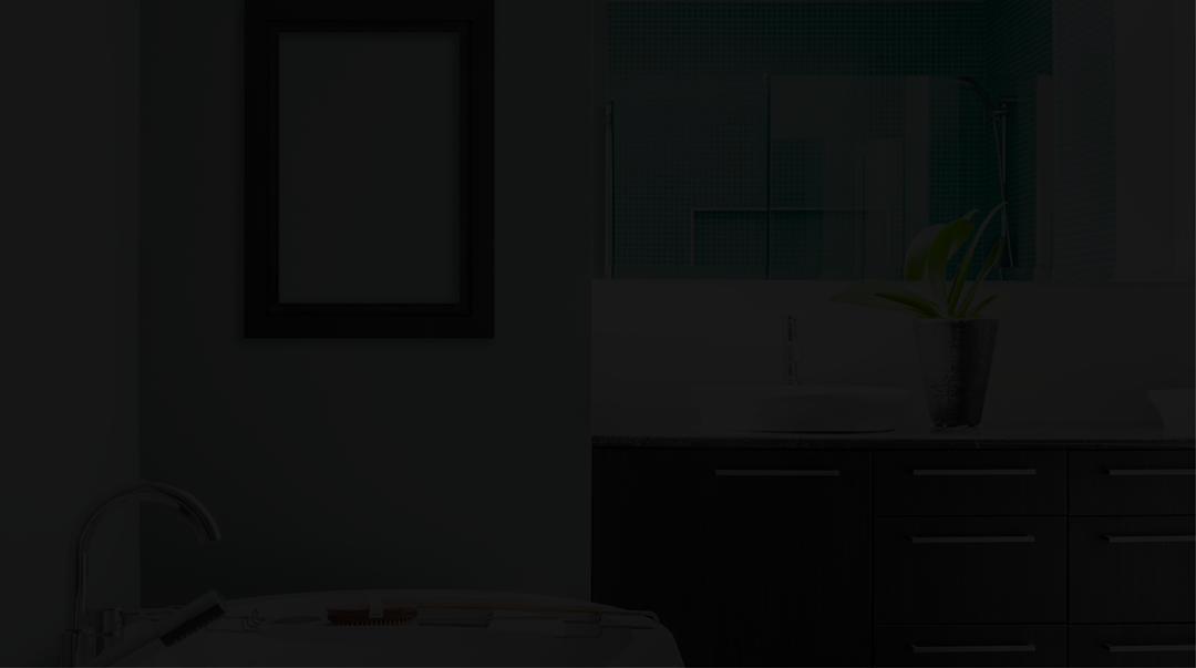 Darkened image of a bathroom with a  picture on the wall